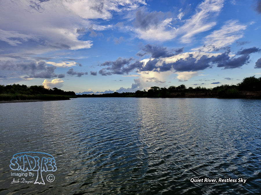 Calm River and Stormy Skies - Scenery